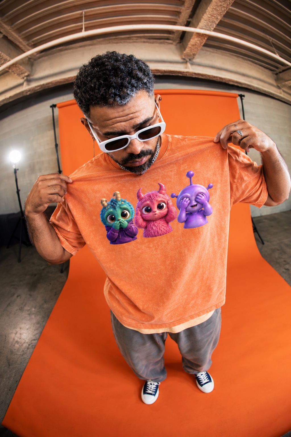 Rony GXP modeling the orange three-alien T-shirt